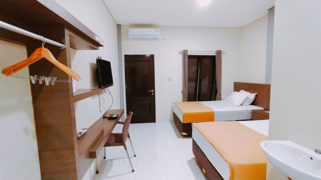 Kamar dengan dua tempat tidur di Tamala Home Stay